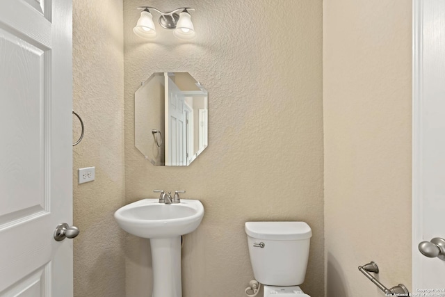 bathroom featuring sink and toilet