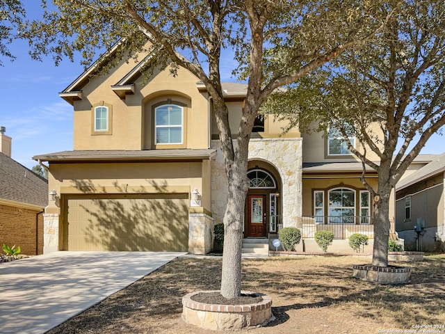 view of front of house featuring a porch and a garage