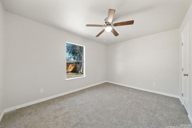 empty room with carpet and ceiling fan