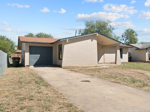 ranch-style home featuring a garage