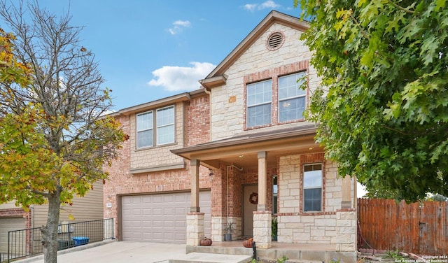 view of front of property with covered porch and a garage