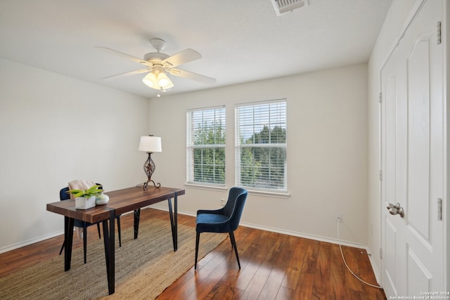 office area with ceiling fan and dark wood-type flooring