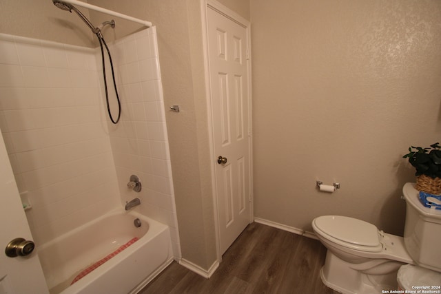 bathroom featuring hardwood / wood-style floors, toilet, and shower / bath combination