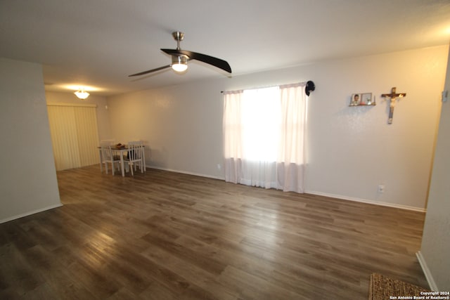 spare room featuring dark hardwood / wood-style floors and ceiling fan