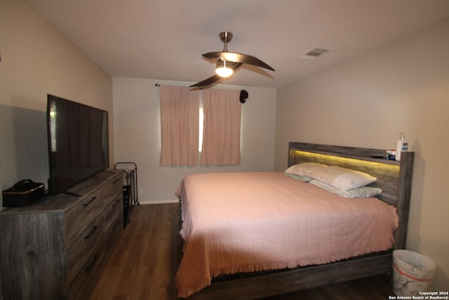 bedroom featuring dark hardwood / wood-style floors and ceiling fan