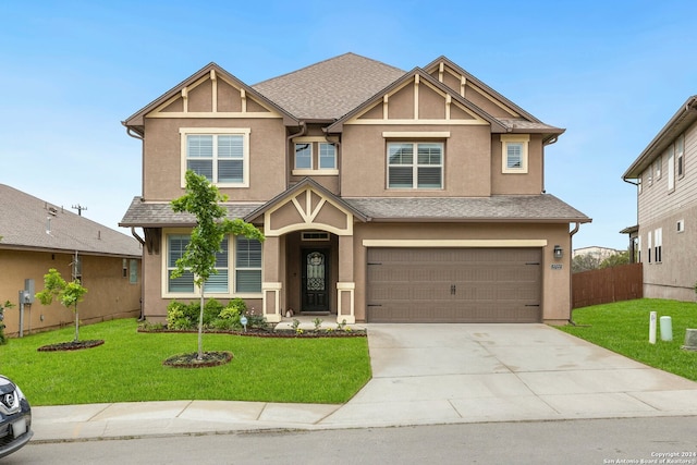 view of front facade featuring a front yard and a garage