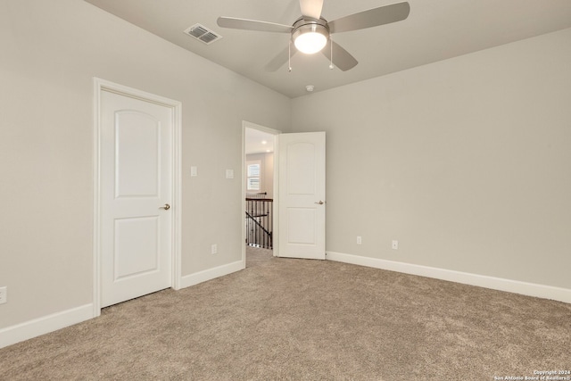 unfurnished bedroom featuring ceiling fan and light carpet