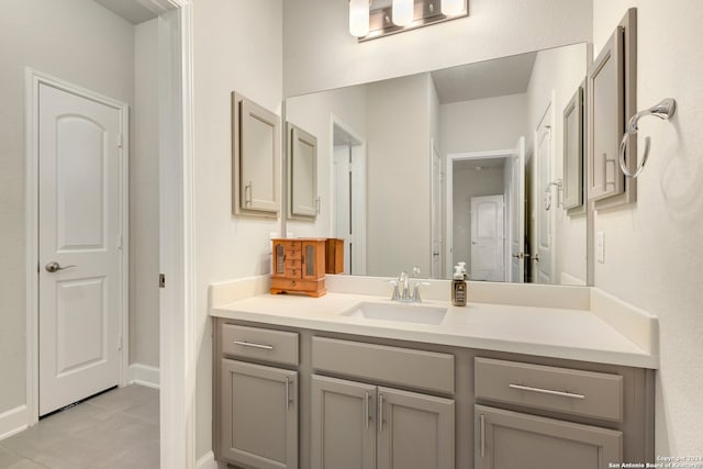 bathroom with tile patterned flooring and vanity