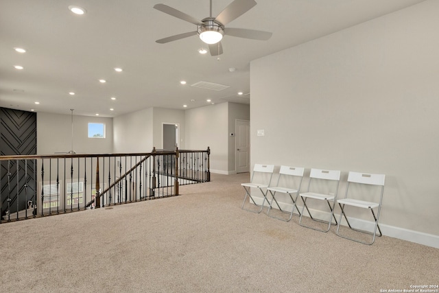 carpeted empty room featuring ceiling fan