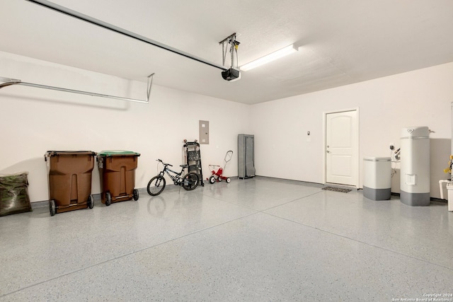 garage with electric panel and a garage door opener