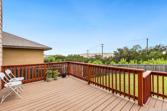 wooden terrace with a yard