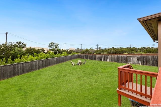 view of yard with a wooden deck