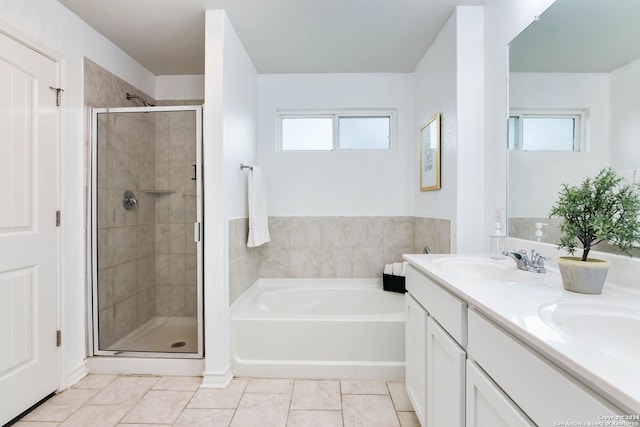 bathroom with tile patterned floors, vanity, and plus walk in shower