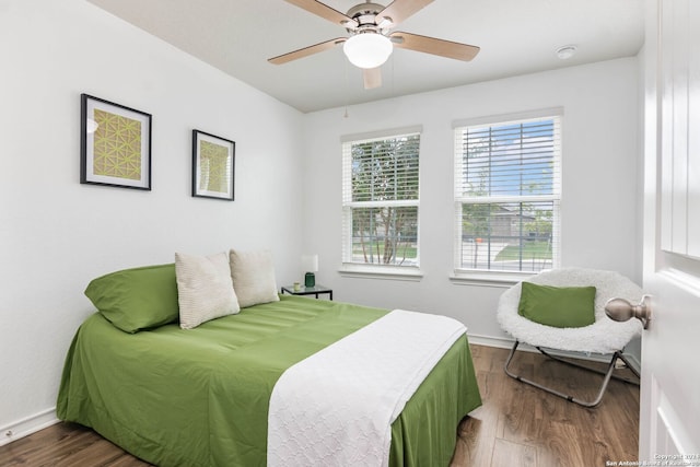 bedroom featuring hardwood / wood-style floors and ceiling fan