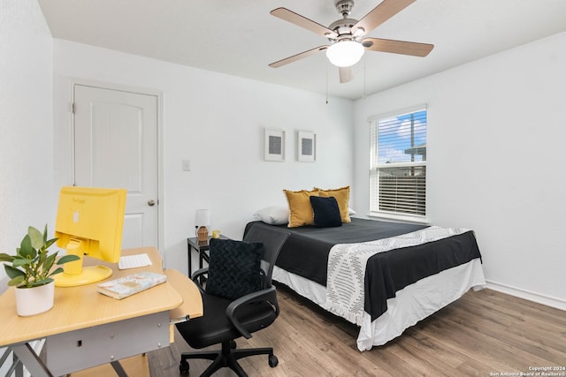 bedroom with wood-type flooring and ceiling fan