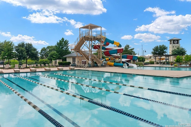 view of pool with a water slide