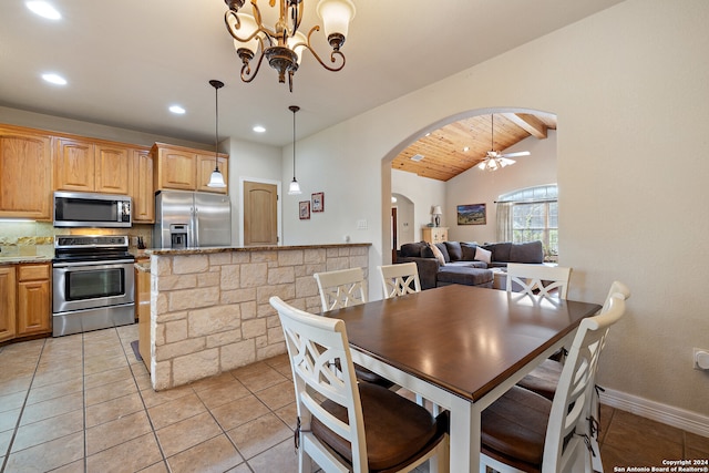 tiled dining room with ceiling fan with notable chandelier, lofted ceiling, and wood ceiling