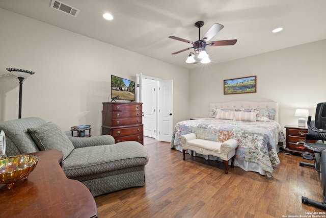 bedroom with ceiling fan and dark hardwood / wood-style flooring