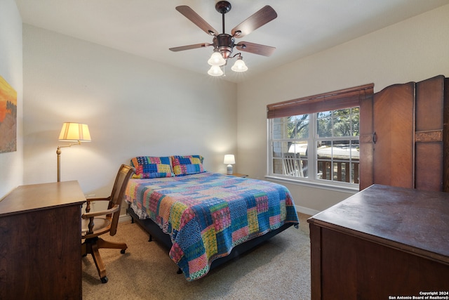 carpeted bedroom featuring ceiling fan