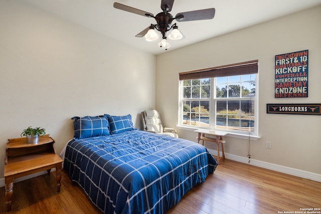 bedroom featuring hardwood / wood-style flooring and ceiling fan