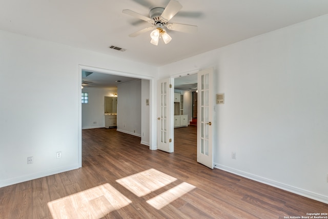 empty room with ceiling fan and wood-type flooring