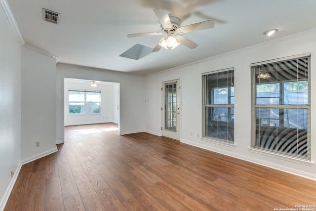 spare room with ceiling fan, wood-type flooring, and ornamental molding