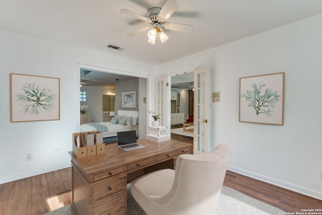 office space featuring wood-type flooring and ceiling fan