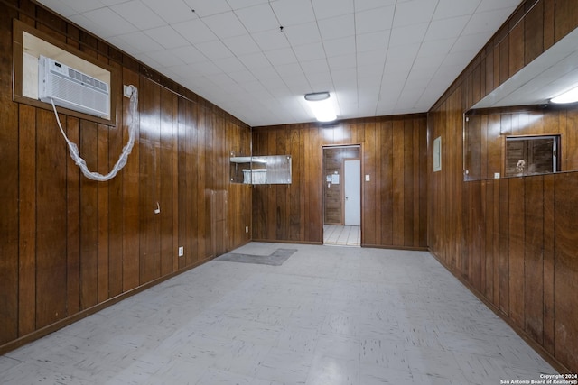 3947 Gayle Ave, San Antonio, TX 78223 - hall with wood walls, a wall mounted AC, and light flooring