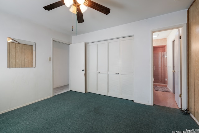 unfurnished bedroom with dark colored carpet, ceiling fan, and a closet