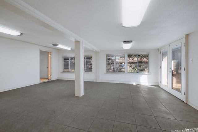 basement with dark tile patterned flooring