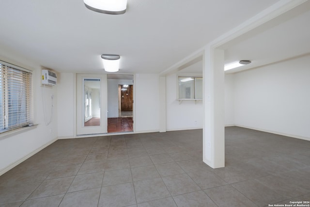 3947 Gayle Ave, San Antonio, TX 78223 - tiled spare room with a wall mounted AC and baseboards