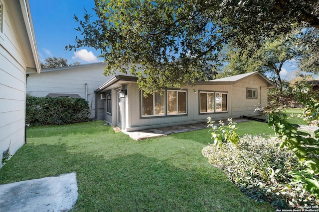 3947 Gayle Ave, San Antonio, TX 78223 - rear view of property featuring a yard