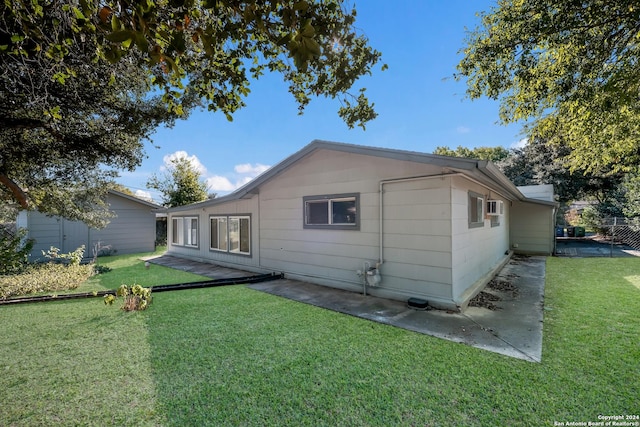 3947 Gayle Ave, San Antonio, TX 78223 - back of house with a yard and a patio