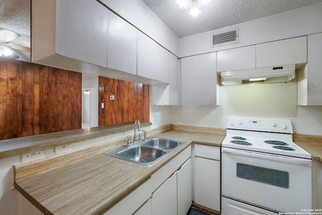 kitchen with white cabinets, sink, ceiling fan, a textured ceiling, and white electric range oven