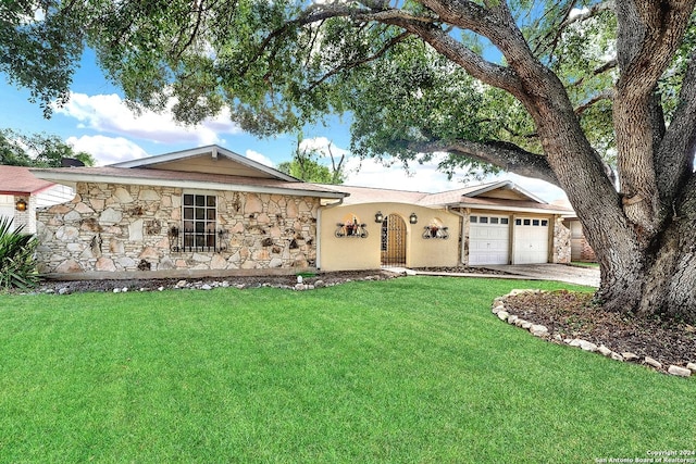 5010 David Scott, Kirby, TX 78219 - single story home featuring stone siding, a garage, a front lawn, and driveway