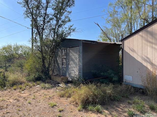 exterior space featuring a storage unit