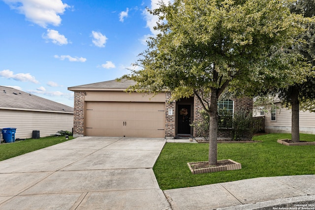 view of front of house featuring a garage and a front yard