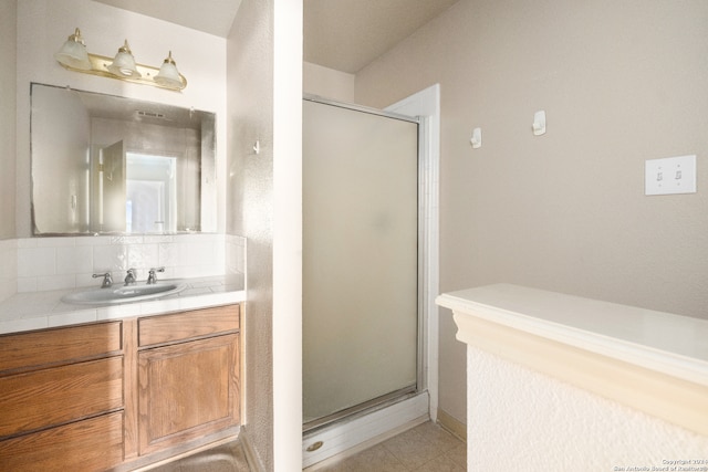 bathroom with vanity and walk in shower