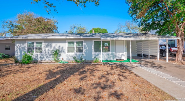 ranch-style home with a carport