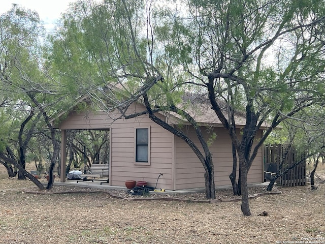 view of side of home with a patio