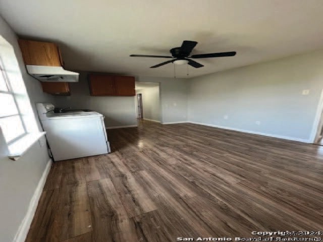 interior space featuring washer / clothes dryer, dark wood-type flooring, and ceiling fan