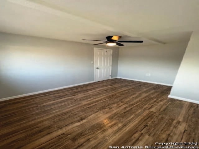 unfurnished room featuring dark hardwood / wood-style floors and ceiling fan