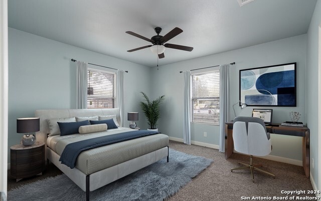 carpeted bedroom with ceiling fan