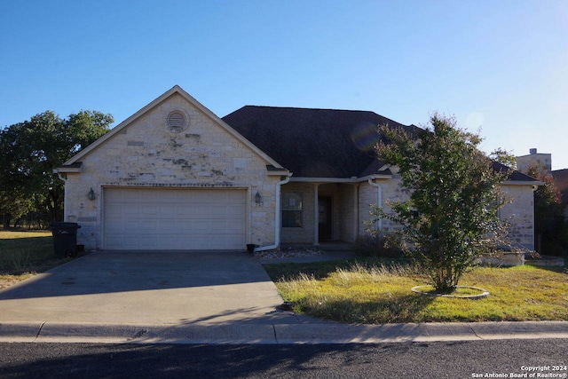 ranch-style home with a garage