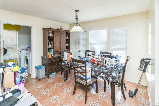 dining room with light tile patterned flooring and washer / dryer