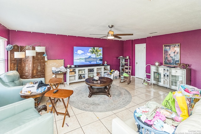 tiled living room featuring ceiling fan