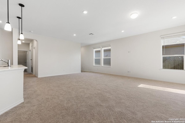 carpeted empty room with sink