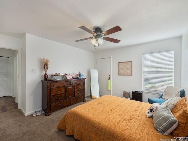 carpeted bedroom with ceiling fan