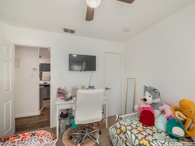 bedroom with ceiling fan and dark hardwood / wood-style floors