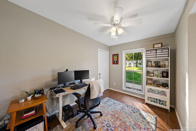 office area featuring ornamental molding, ceiling fan, and dark wood-type flooring